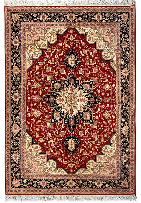 Full view of 5'2" x 6'6" Persian Tabriz rug, rust field, ivory star medallion, navy border