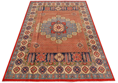 Coral and blue Mamluk medallion rug photographed at an angle showing ivory rosette main border