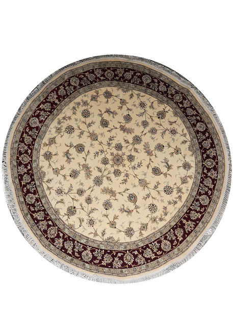 Full overhead view of the 8' x 8' round ivory and ruby red wool and silk rug