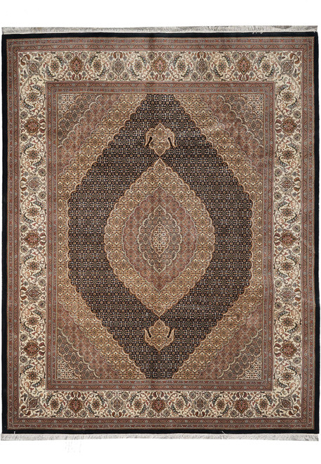 Full view of 8'2 x 10'3 black Tabriz Mahi rug with ivory border and rose medallion