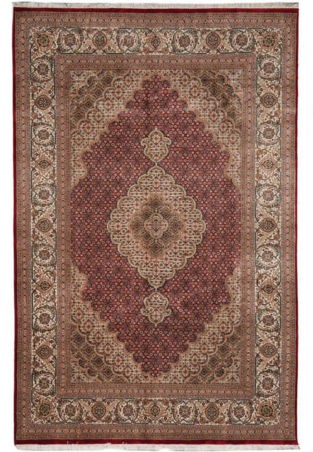 Ruby red Tabriz Mahi design rug with ivory scalloped medallion and dense herati fish field