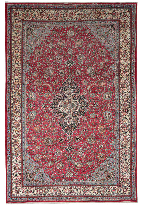 Full overhead view of red Persian Tabriz rug with navy medallion and ivory floral border