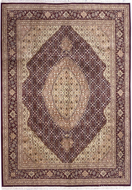 Full overhead view of burgundy Mahi Tabriz design rug with beige medallion and floral border