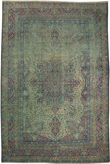 Full overhead view of the 7'9" x 11'3" antique Persian Kerman rug with green floral field