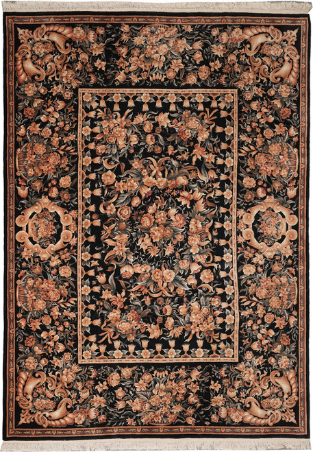 Full view of 9' x 12' black French floral Oriental rug with coral bouquets and ivory fringe