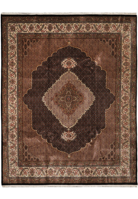 Full overhead view of black and camel Mahi Tabriz design rug with ivory scalloped medallion