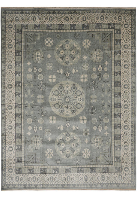 Full view of 8'11" x 11'10" Chotan rug with grayish blue field and ivory rosette medallions
