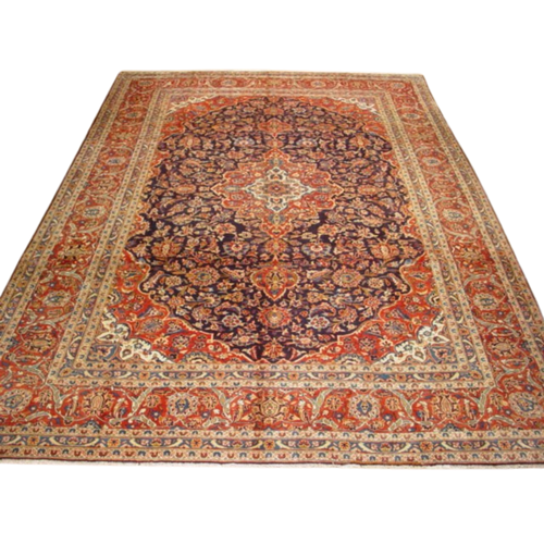 9'4" x 12'8" Persian Kashan rug with navy floral field and red floral borders