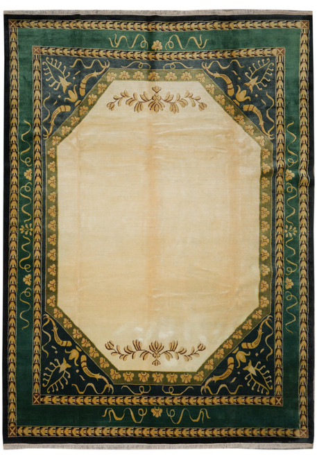 Full overhead view of beige field Indian transitional rug with forest green and gold borders