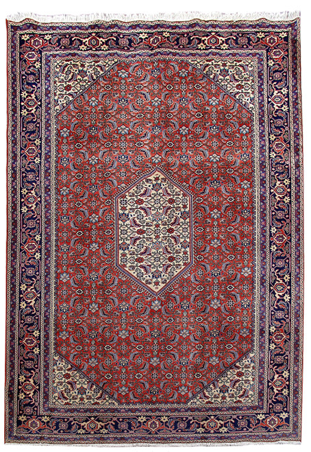 Red Persian Ardebil rug with ivory hexagonal medallion, allover Herati field and navy palmette border