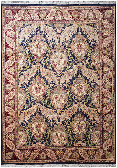 Overhead view of black damask rug with burgundy border, salmon palmettes and olive scrolling leafwork