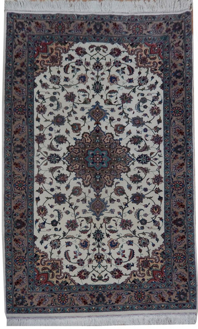 Ivory field Persian Tabriz rug with mauve medallion, camel border and green guard stripes, full view