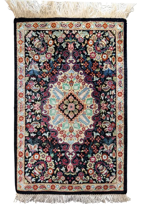 11.5 x 18 inch Persian Qum pure silk baby rug with black field, ivory floral medallion and long silk fringe