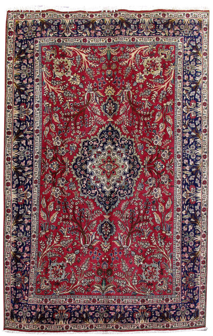 Red Persian Tabriz rug with navy floral border and ivory central medallion, full overhead view