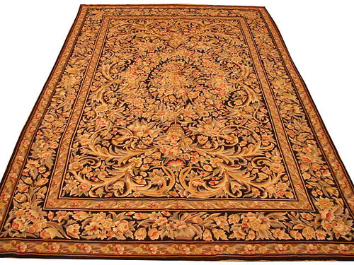 Full view of 5'8" x 9' black needlepoint Aubusson rug with ivory acanthus scrollwork