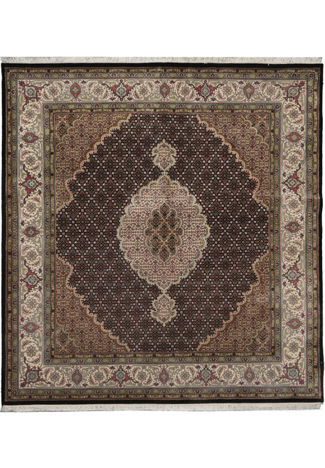 Square black and ivory Mahi Tabriz rug shown flat with fish medallion and floral border