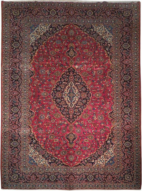 Red Persian Kashan rug with navy lobed medallion, ivory corner spandrels and dense floral field