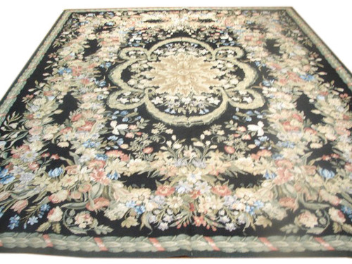 8 x 10 Chinese needlepoint Aubusson rug with black field, ivory medallion and floral garland border