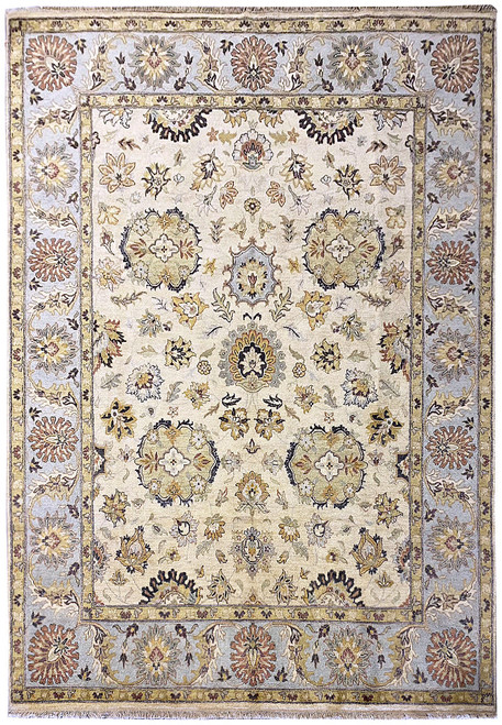 Ivory 8x10 Oushak rug with light blue border, gold palmettes and sage floral rosettes
