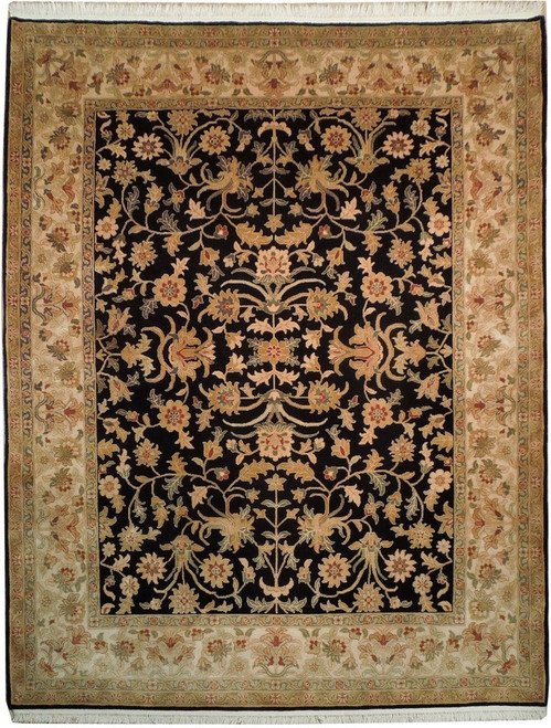 Full overhead view of black field Ziegler rug with ivory floral border and all-over vines