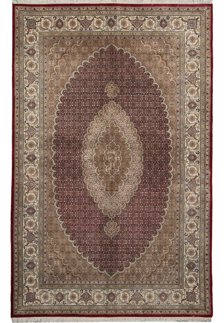Full overhead view of ruby red Mahi fish design rug with ivory oval medallion and floral border