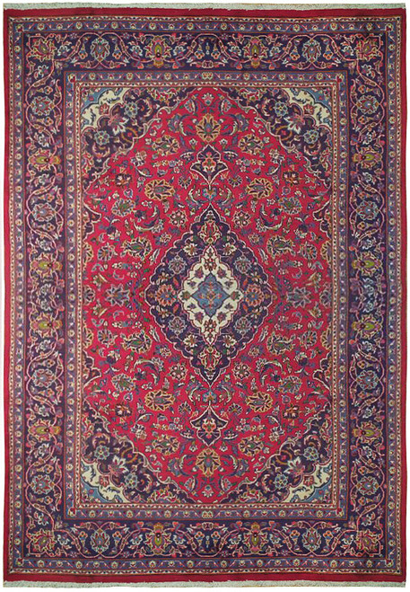 Full overhead view of red Persian Kashan rug with ivory medallion and navy floral border