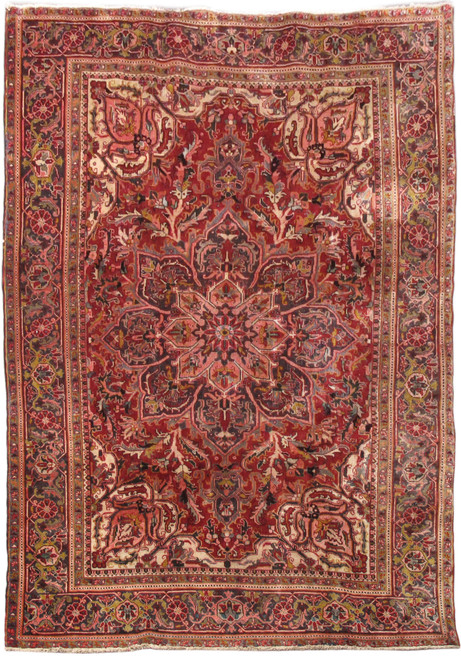 Full overhead view of red Persian Heriz rug with large geometric medallion and ivory corner spandrels