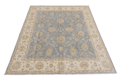 Bluish gray Chobi Peshawar rug with ivory floral border, photographed flat from one corner
