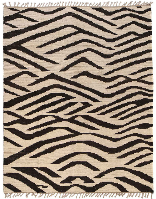 Whole rug seen from above, taupe field with dark branching bands and tasselled fringe at both ends