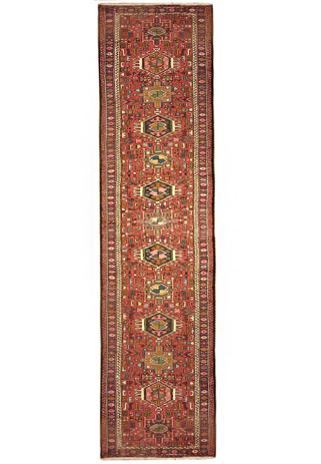 Full length view of the 2'8" x 15'4" Persian Karajeh runner, medallion column on red