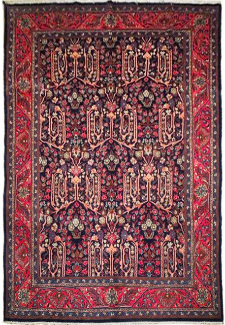 Full overhead view of the navy Bijar rug with coral cartouches and a red floral main border