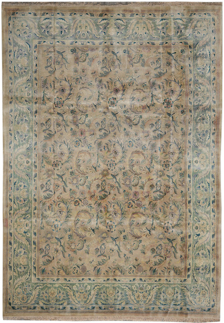 Whole tan Chobi Peshawar rug photographed flat from above, pale green floral border all round
