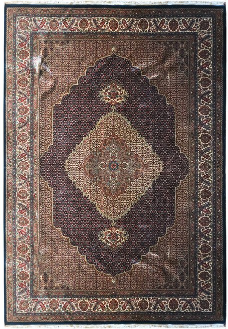 Full overhead view of black and ivory Mahi rug with central diamond medallion and ivory palmette border