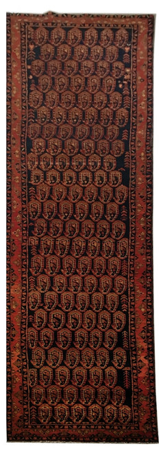 Full runner laid flat, dark field of rust boteh rows inside a wide rust border