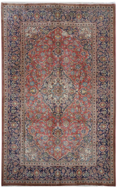 Rose red field and navy border on 6'7" x 10'6" Persian Ardakan rug, overhead