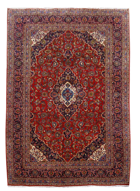 8'2" x 11'8" Persian Kashan rug with red field, navy border and ivory corner spandrels