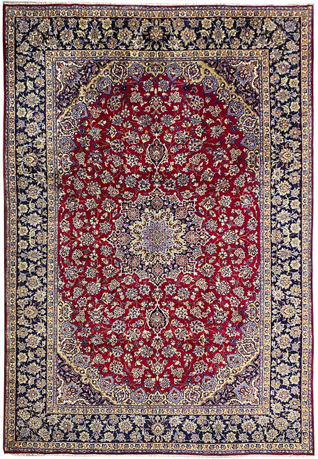 9'9" x 13'10" Persian Najafabad rug shown flat with red field and navy floral borders