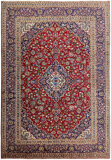 Full overhead view of 9'8" x 13' Persian Kashan rug with deep red floral field and navy border