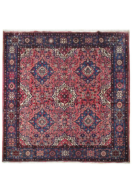 Square 6'8" x 6'8" Persian Sarouk rug with rose-red floral field and navy blue border