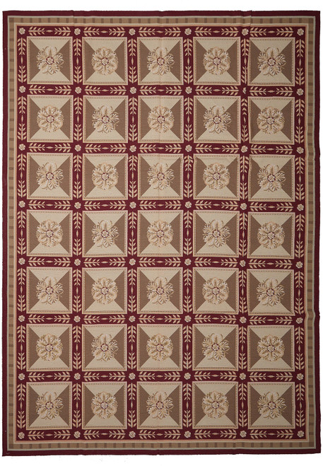 Overhead view of 9x12 rust and olive needlepoint rug with 35 floral rosette panels