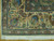 Peach main border corner with cotton fringe, blue, green and rust palmette flowers in wool
