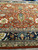 14x22 oversize rug detail with ivory rosettes, navy cartouches and layered guard stripe borders