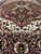 12' x 15'10" Indian Heriz rug detail where burgundy field meets ivory and black borders