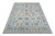 12'3" x 15' Indian Oushak rug shown at an angle, ivory ground with multicolor floral design