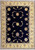 Overhead view of 10x13 Persian Tabriz rug with midnight blue field and ivory floral border