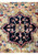 Close-up of the central medallion on 12 x 15 Oriental Ziglar Rug with rich colors and detailed patterns.