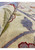 Rolled view of the 12 x 16 Ziglar Rug highlighting texture and thickness.