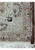 Reverse side of a hand-knotted Persian Tabriz rug showing the fine cotton foundation weave