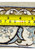 Tape measure on the back of a 6'9 x 10'1 Persian Isfahan rug showing the knots per square inch