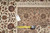 Back of the rug with a tape measure and a hand-woven oriental rug tag on the pile